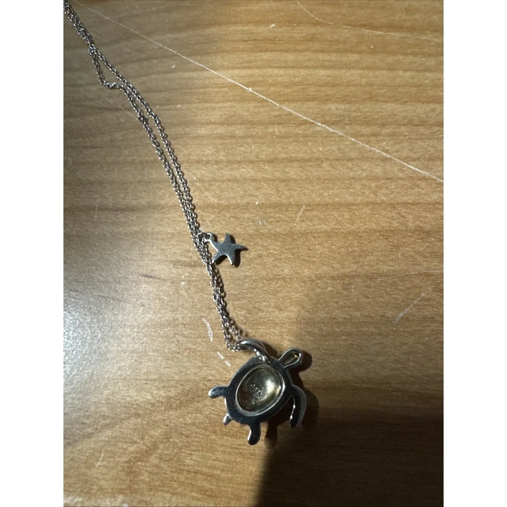silver turtle necklace with simulated blue opal